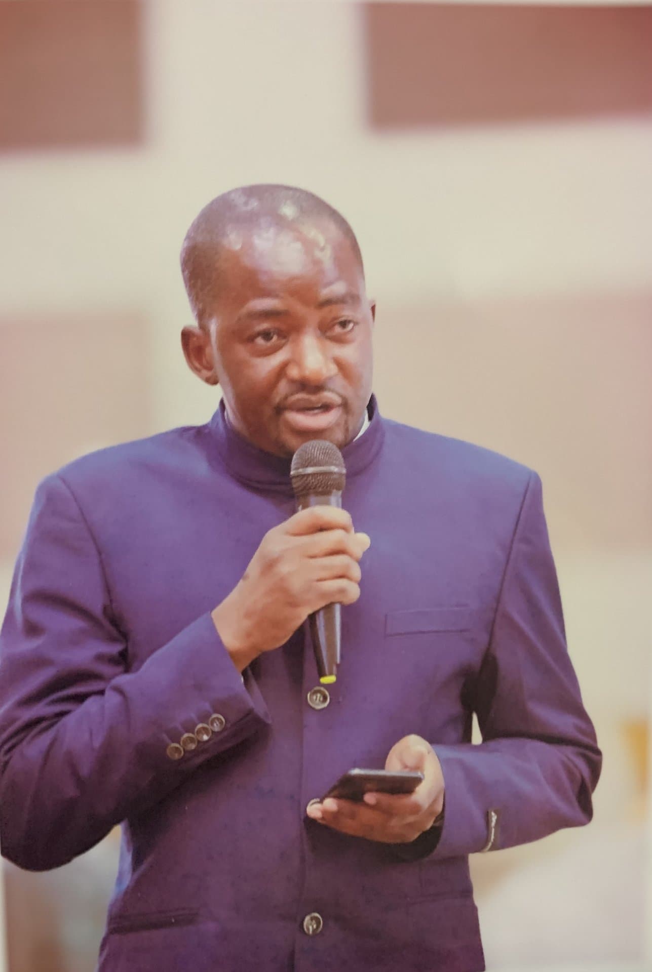 An Epiphany University Zambia faculty member addressing an audience